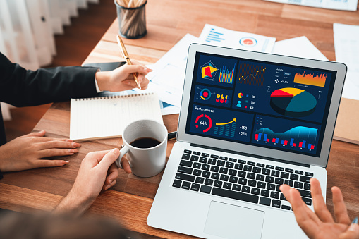 Financial data analysis dashboard by Fintech BI or business intelligence display on laptop screen to in-depth financial data analysis by business people working on business marketing. Habiliment