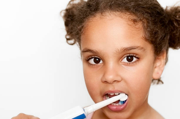 istock Little Girl (5-6) Brushing Her Teeth 175445774
