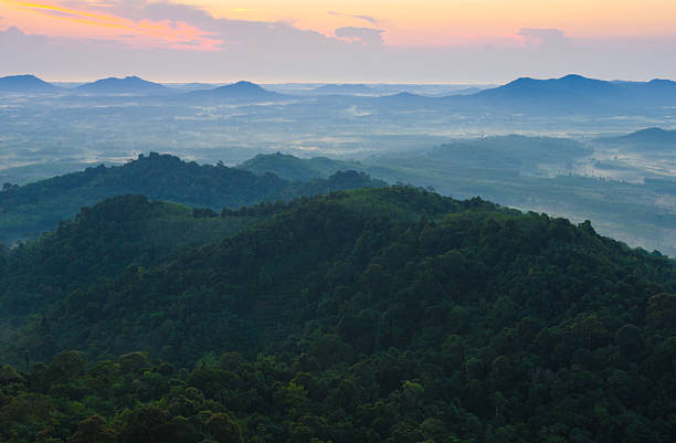 Beautiful sunrise at misty morning mountains .
