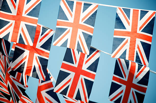 istock Union Jack British Flags Hang Across Blue Sky 175446137