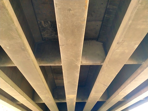 Pre-cast concrete girder beams under the bridge
