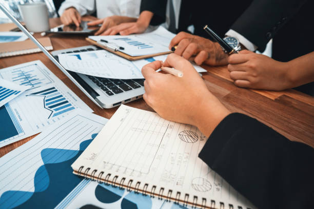 istock Group of business analyst team analyzing financial data report. Habiliment 1754463076