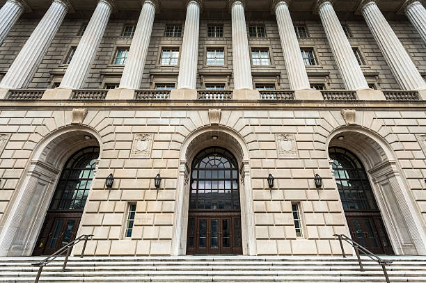 Internal Revenue Building The IRS Service Building on Constitution Avenue in Washington DC. IRS Headquarters Building stock pictures, royalty-free photos & images