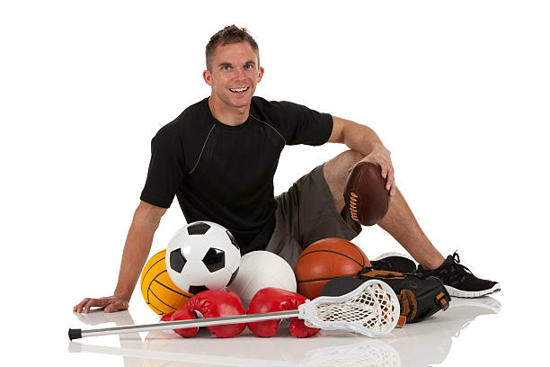 istock Man sitting with various sports equipment 175446423