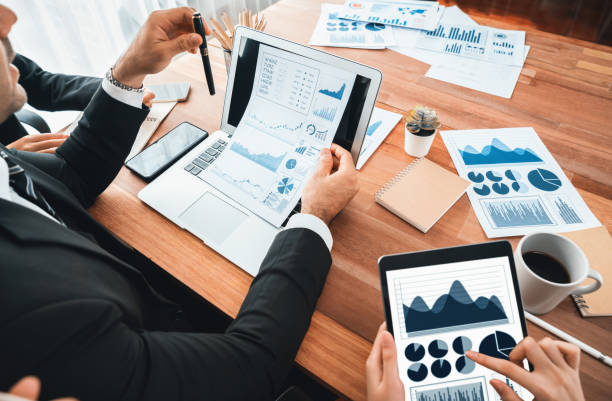 istock Group of business analyst team analyzing financial data report. Habiliment 1754465461