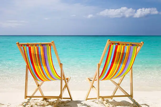 Photo of colorful chairs at a topical Caribbean beach