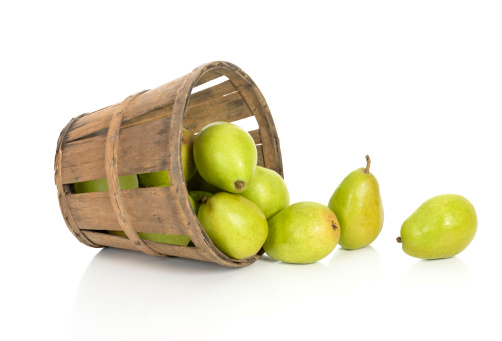 Anjou pears in a tipped basket.