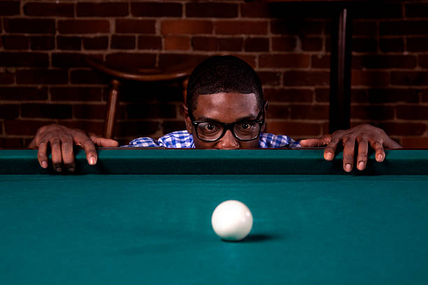 istock Geek at the Pool Table and Cue Ball 175446914