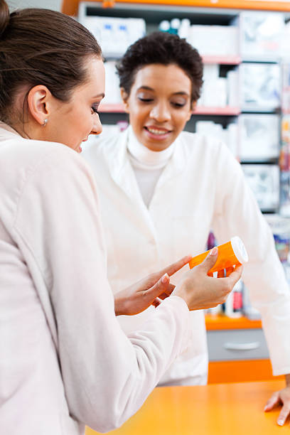 istock Customer and pharmacist talking in the pharmacy 175447139