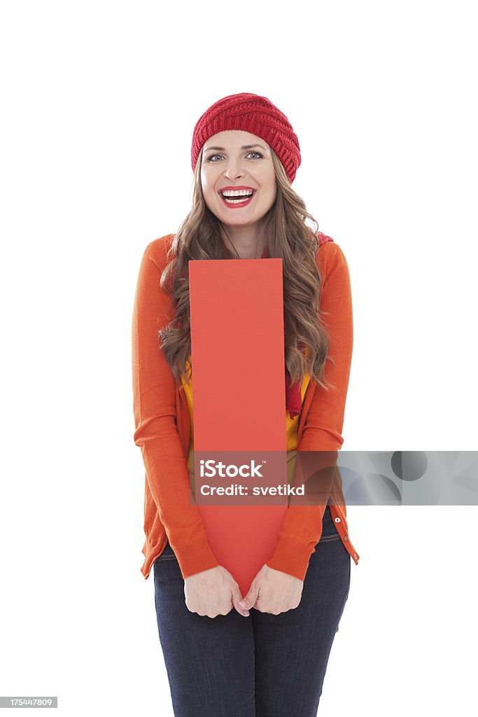 Woman holding letter I. Attractive woman in autumn clothes holding big 3D letter I and smiling at camera. Isolated on white. People with letters and numbers concept. Look for other images from this series. Click on image below for lightbox. 30-34 Years Stock Photo