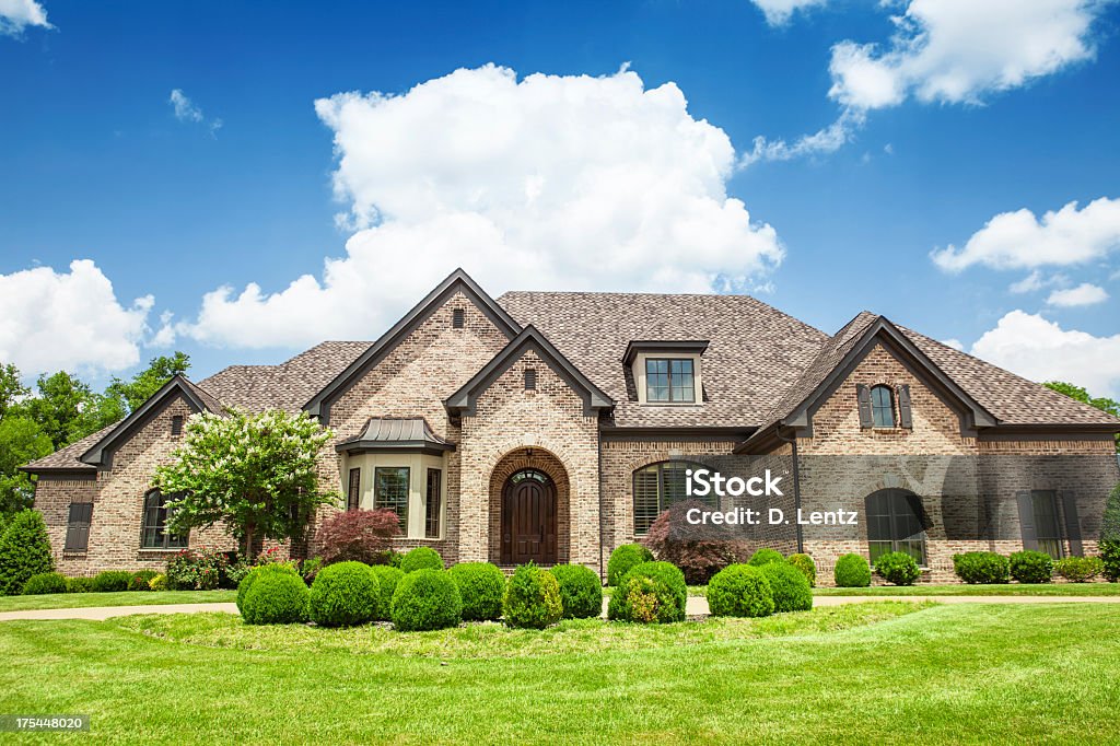 Beautiful mansion with a green yard A luxury mansion House Stock Photo