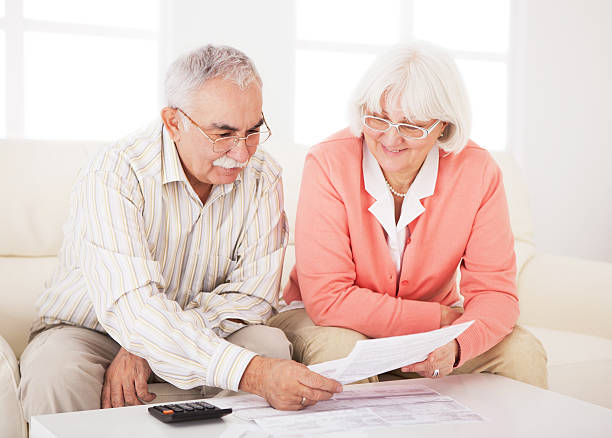 istock Senior couple with bills. 175448135