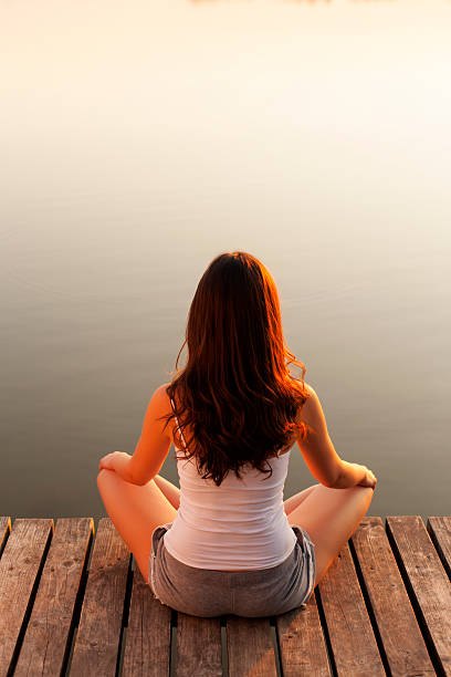 istock Young woman enjoying the sunset 175448181