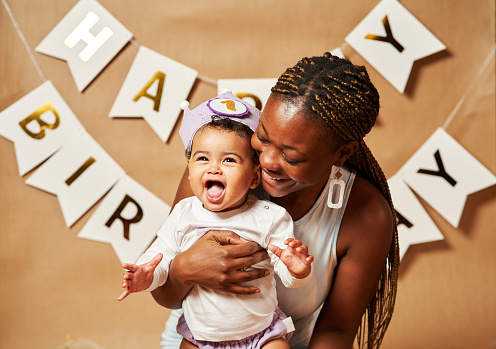 woman with funny baby celebrating first birthday