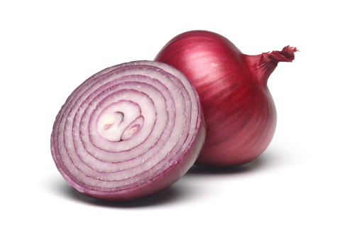 Sliced Red onion on white.
