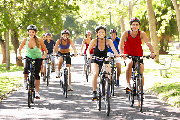 istock Group Of Cyclists On Cycle Ride Through Park 175448522
