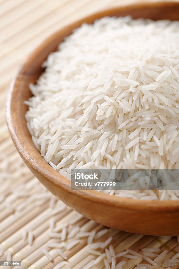 Basmati rice Wooden bowl full of basmati rice Abundance Stock Photo