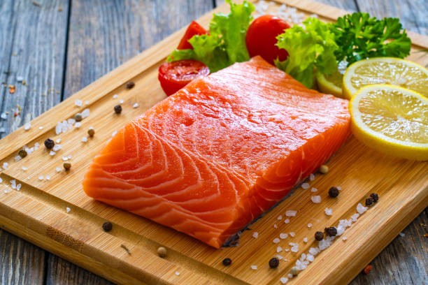 istock Fresh raw salmon steak on stone cutting board 1754489464