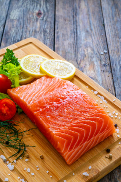 istock Fresh raw salmon steak on stone cutting board 1754491058