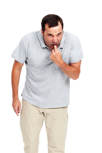 Mature man gesturing as though he's about to vomit from disgust while isolated on white - portrait