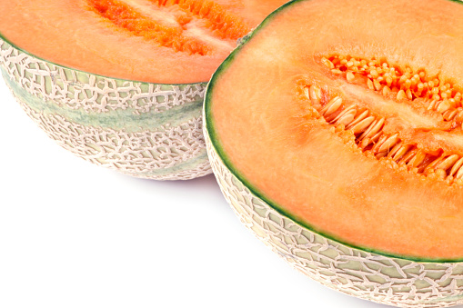 Cantaloupe on white background. Close-up of cross section.
