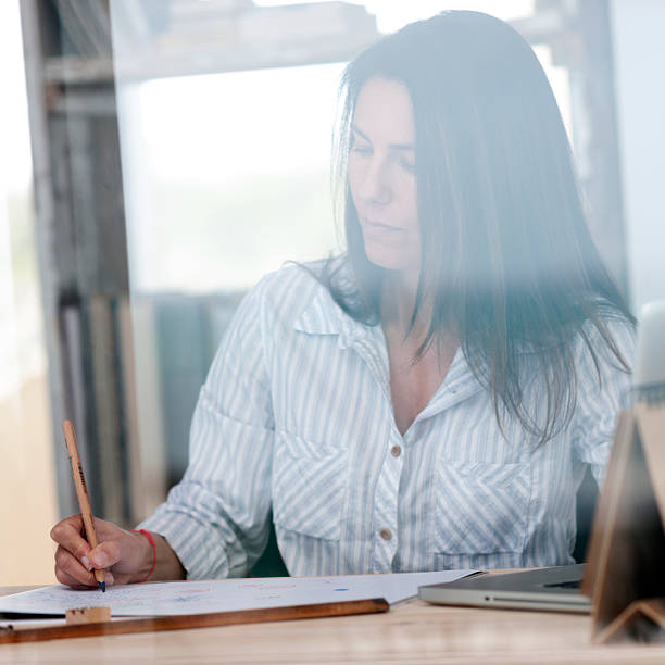 istock Woman working in her home office 175449877