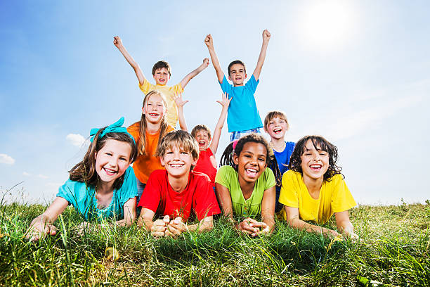 istock Happy kids lying in field and looking at camera. 175449896