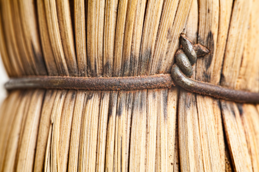 Rusty wire detail. Straw broom macro