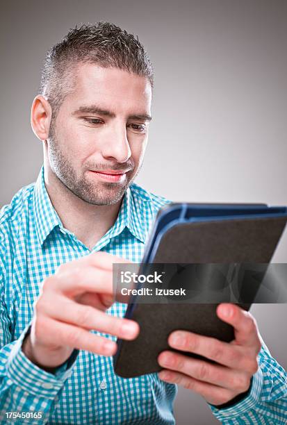 Man Reading Ebook Stock Photo - Download Image Now - 30-34 Years, Adult, Adults Only