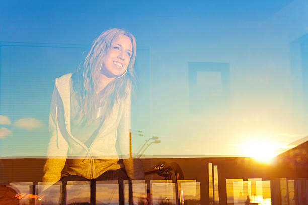 istock Young Woman In The Window 175450389