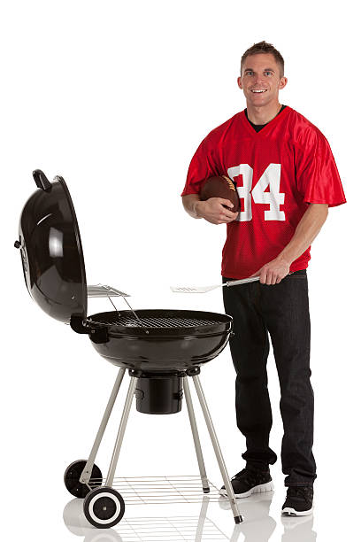 Sportsman cooking at barbecue grill