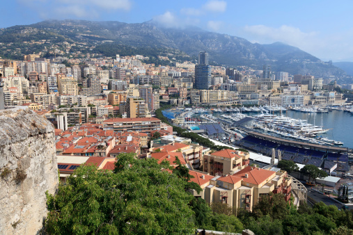Preparations for the Grand Prix - including Grand Stands and the Race Course setup on the the streets of Monaco - gets underway at Port Hercule in Monte Carlo that's filled with multi-million dollar yachts - and a city and country overflowing with all of symbols of wealth and high fashion.