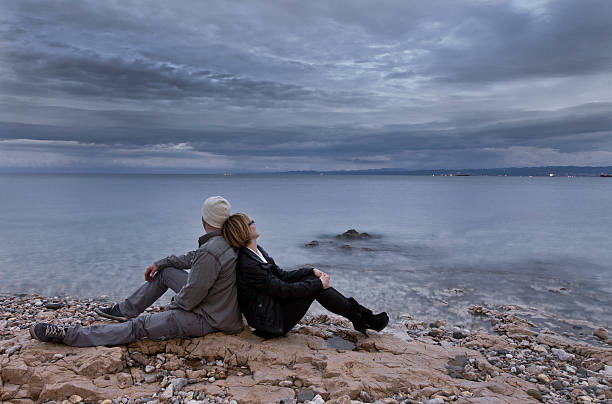istock Couple looking at stormy sky 175450569