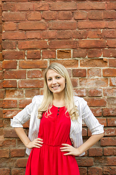 istock Beautiful woman against brick wall 175450817