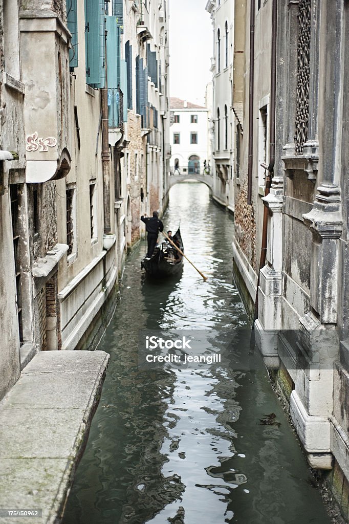 One gondola on Venice canal ** motion blur on gondola and people on bridge** One gondola on Venice canalClassic and different takes on Venice and the Veneto here Bridge - Built Structure Stock Photo