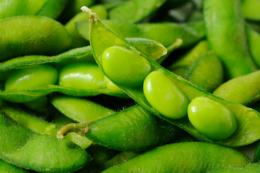 Close-up shot of opened fresh boiled green soybeans on soybeans.