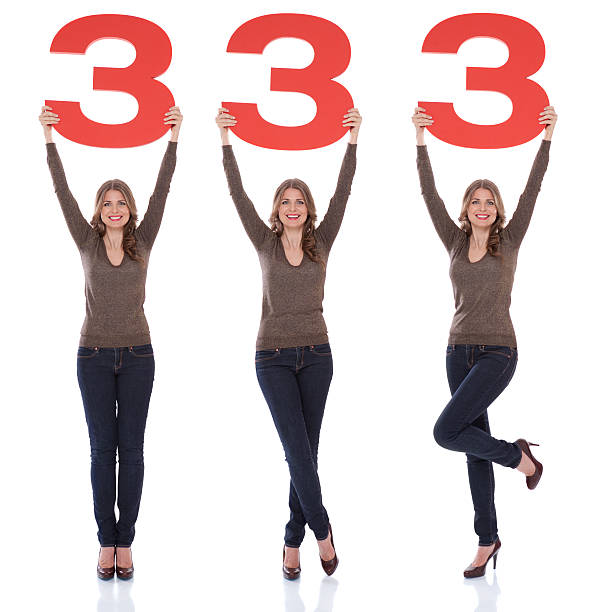 istock Woman holding number 3. 175451014