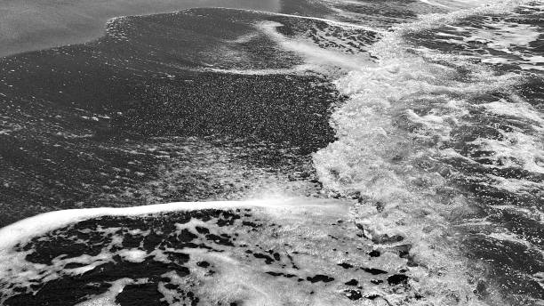 istock Waves crashing on the shore, beach. close up holiday background. 1754514623