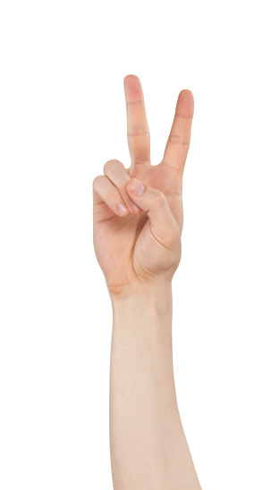 Female hands making a V-sign, gesturing and communication concept, blank copy space