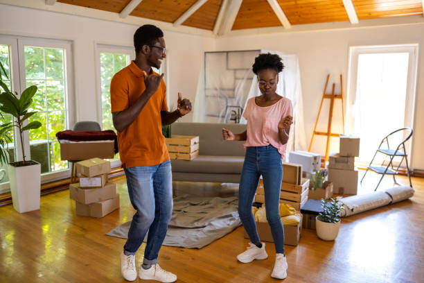 istock Happy couple dancing in new home 1754523556