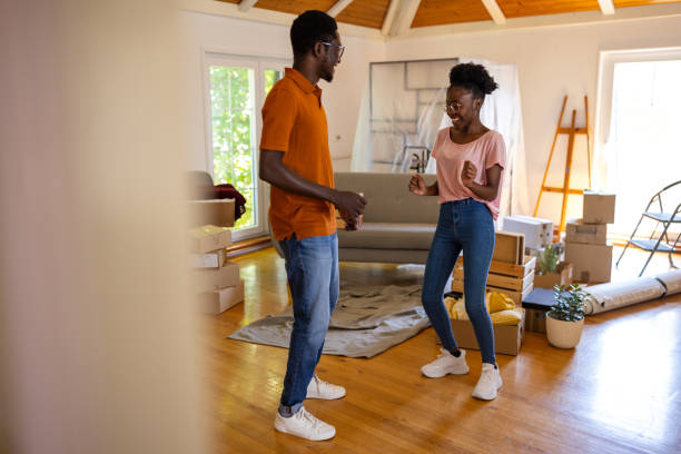 istock Happy couple dancing in new home 1754523604