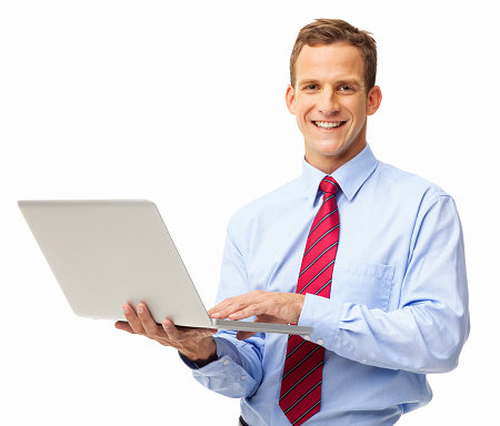 Portrait of happy young businessman using laptop. Horizontal shot. Isolated on white.