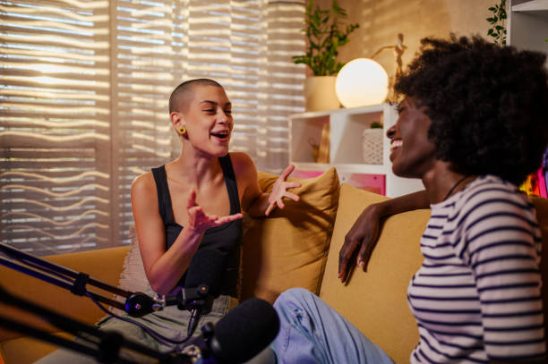 istock Two diverse women recording internet podcast in a modern cozy studio 1754526479