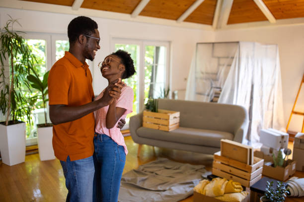istock Happy couple dancing in new apartment 1754527088