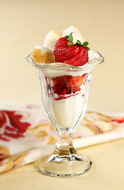 "Healthy parfait made with non fat yogurt, sliced fresh strawberries and topped with sponge cake cubes. See other desserts in my SWEETS Lightbox"