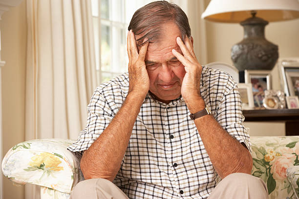 istock Unhappy Retired Senior Man Sitting On Sofa At Home 175453209