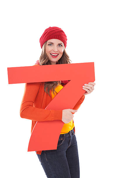 istock Woman holding number 7. 175453273