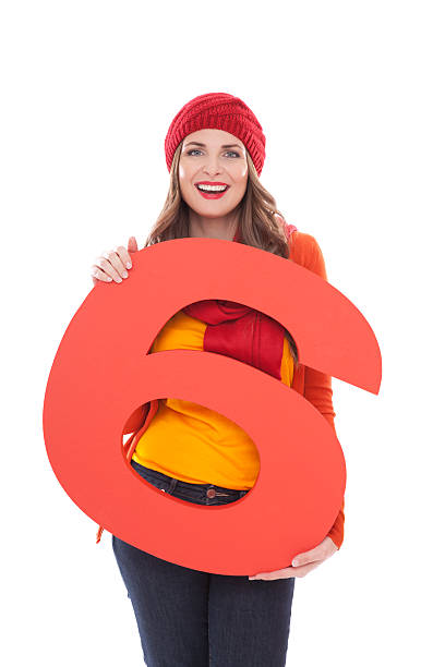 istock Woman holding number 6. 175453400
