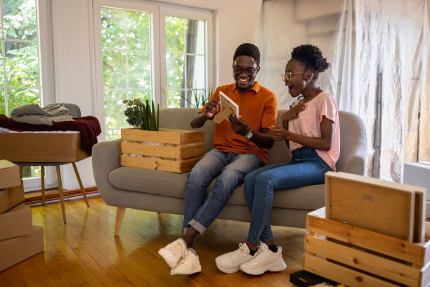 istock Couple unpacking in new home 1754534202
