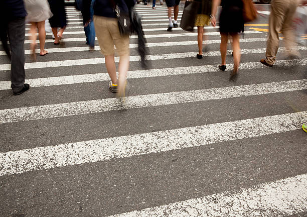 istock Pedestrians crossing at intersection, New York City 175453452